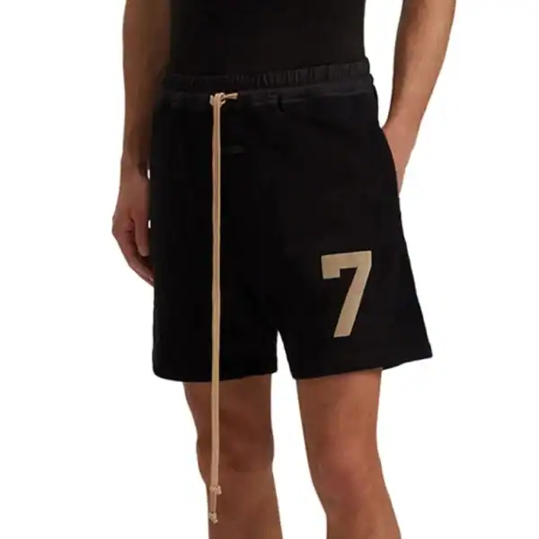 Athletic black shorts with beige number 7 and drawstring, latest cheap apparel.
