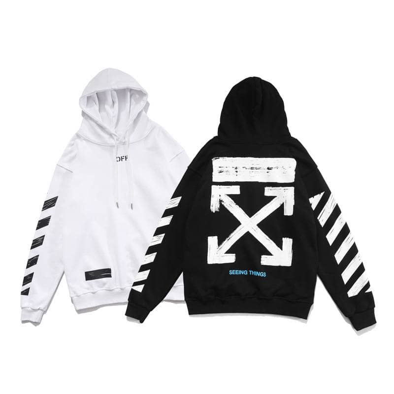 White and black hooded sweatshirts with modern graphic designs and text.