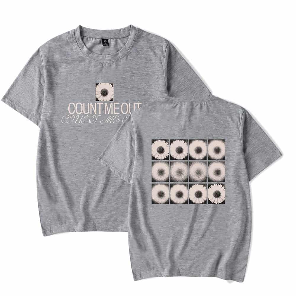 Soft gray graphic t-shirt with daisy pattern and "COUNT ME OUT" text, casual and trendy, available at affordable prices.