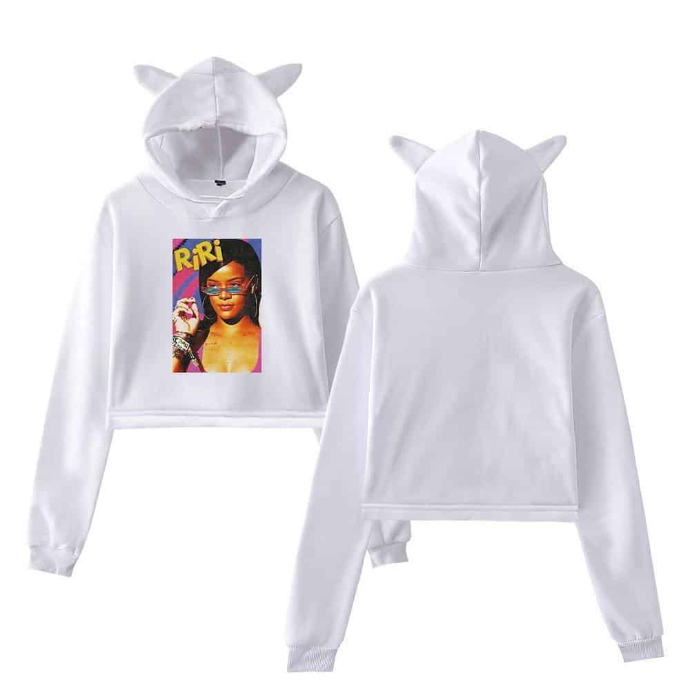 White hoodie with cat ear hood and graphic print of Rihanna on front, casual streetwear style.