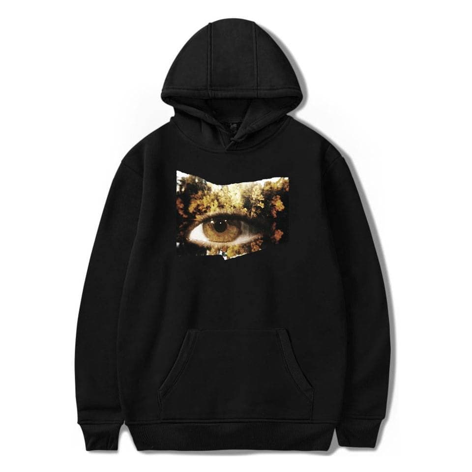 Eye-catching hoodie with a surreal eye and forest print, perfect for casual and trendy looks.