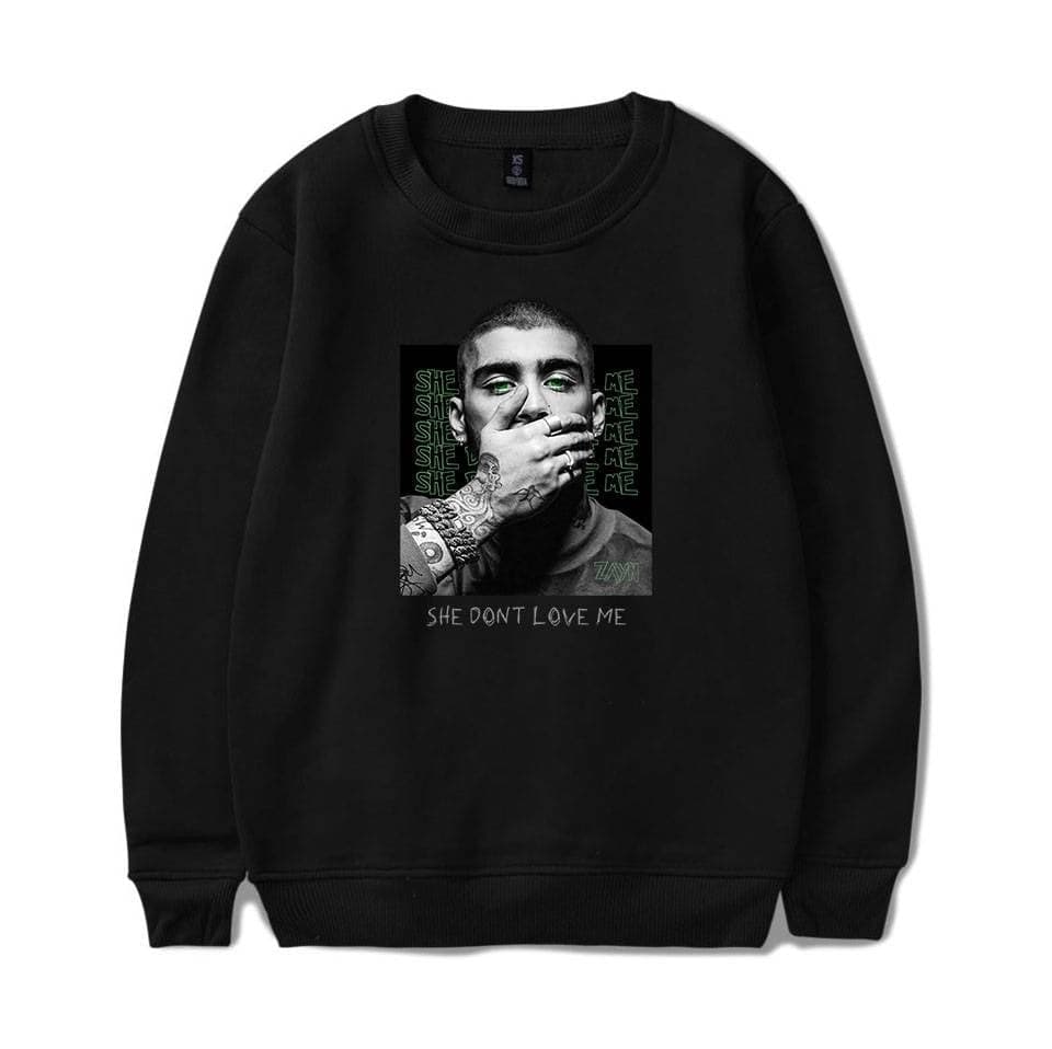 Cheap apparel, latest fashion, black hoodie with pop art style print, featuring a monochrome portrait with green eye makeup, bold text, and distressed message, suitable for streetwear style and casual wear.